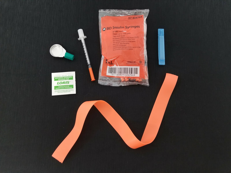 Insulin syringes with cooker, sterile water, alcohol swab, and tourniquet